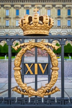 Fence of the eastern facade of The Royal Palace of Stockholm, Swedish: Stockholms Slott or Kungliga Slottet, with the royal golden crown, King's official residence, located at Old Town, or Gamla Stan