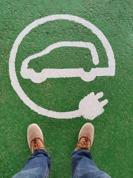 Floor signal that indicate electric car charging station. Selective focus