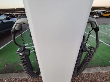 Vehicle connectors at electric car charging station. Selective focus