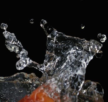 Isolated splashes of water on a black background. The concept of food.