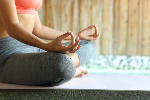 Close up of a yogi hands doing yoga meditation exercise in spa