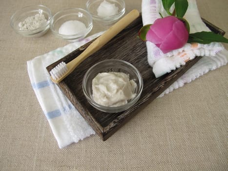 Homemade toothpaste from three ingredients with coconut oil, xylitol and chalk powder