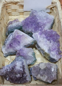 Amethyst Fragments, believed to have beneficial health properties. Displayed on basket at street market stall