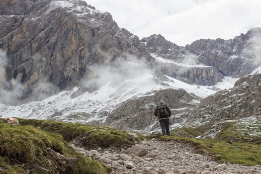 man trekking in the mountains, Alps in Austria, Lienzer Dolomiten, East Tyrol