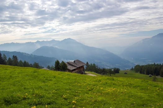 Landscape of Lienz Dolomites in Austria. Road and panorama of massive Alpine mountains. East Tyrol