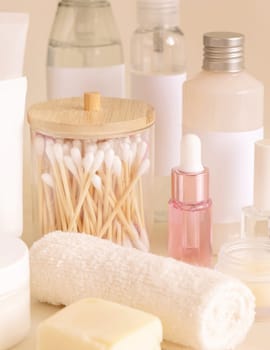 Natural cosmetic jarsand bottles and skin care accesories on light yellow close up. Beauty products. Everyday woman face care routine, Spa Treatments