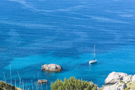 Picturesque sea landscape with bay and sailing ship on Mallorca, Baleares in Spain.