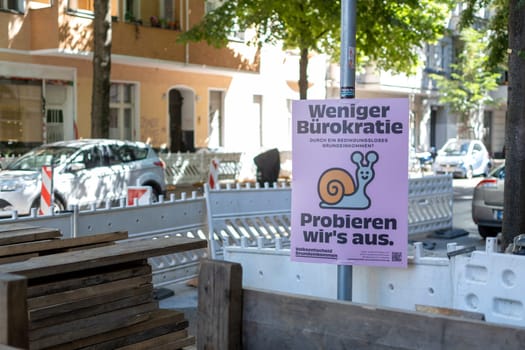 Berlin, Germany, June 2022: Volksentscheid direct democracy political advertisement in Berlin promoting less bureaucracy and Universal basic income
