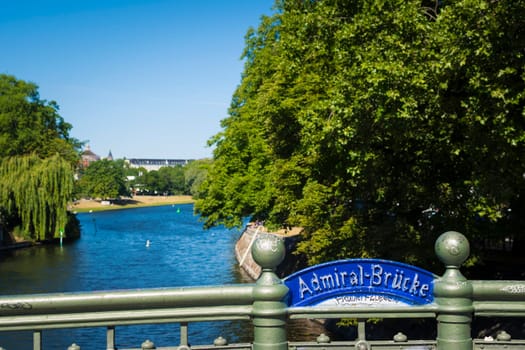 Berlin, Germany, June 2022: View from the Admiralbrucke bridge over the Landwehr canal on the border of Neukolln and Kreuzberg in Berlin