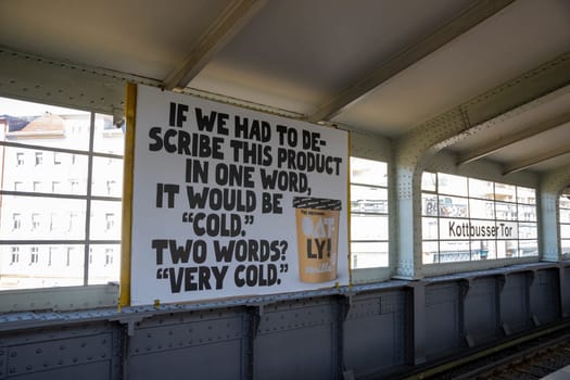 Berlin, Germany, June 2022, Illustrative Editorial: Big ad for Oatly plant based and vegan ice cream in Kottbusser Tor metro station in Berlin