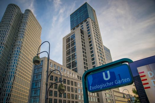 Berlin, Germany, June 2022: View on skyscrapers on Zoologischer Garten U-bahn or metro station with Waldorf Astoria hotel.