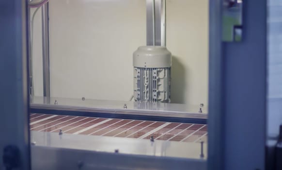 Line for the production of chocolate in an industrial factory. Automatic process in the production line of sweets. Images from the chocolate factory during production. Conveyor belt with sweets