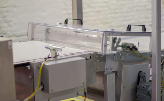 Factory for the production of sweets and chocolate. Automatic line for the production of chocolate in an industrial factory. Conveyor belt with sweets. Sweets production process. Food industry