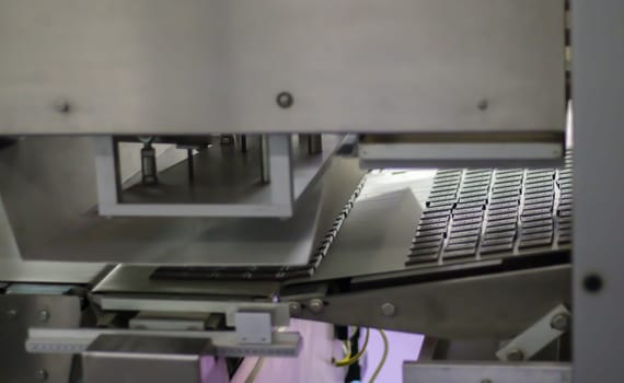 Factory for the production of sweets and chocolate. Automatic line for the production of chocolate in an industrial factory. Conveyor belt with sweets. Sweets production process. Food industry