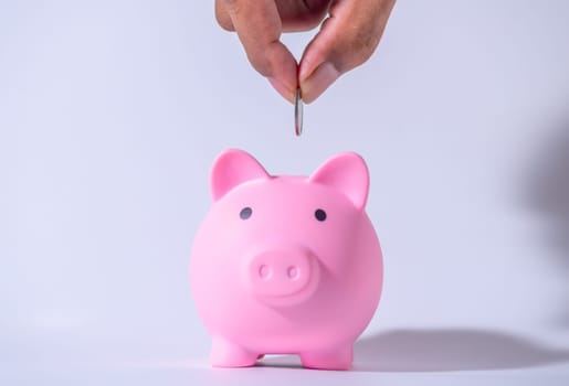 Save money and account banking for finance concept, Hand with piggy bank and coin on blurred background, Save Monney for Investors Using Internet to Trade Stocks or Trade Fund
