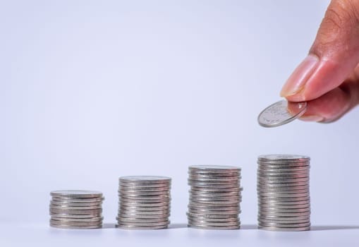 Save money and account banking for finance concept, Hand with coin on blurred background, Save Monney for Investors Using Internet to Trade Stocks or Trade Fund