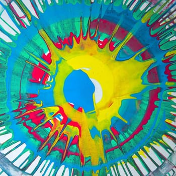 splatter splash real paint abstract sun centered spinning fluid vibrant green blue yellow red background messy splattered grunge style graphic design