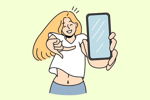 Smiling girl pointing at smartphone screen