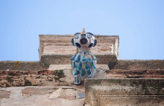 Porcelain gargoyle of Palace of Weathervanes, Caceres historic quarter, Extremadura, Spain