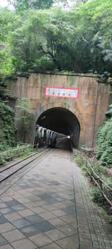 Baiji Tunnel, Taoyuan City - Jul 27, 2022 : Originally part of the north section of the cross-Taiwan No. 7 highway, the Japanese opened a special tunnel for pedestrians, air defense and evacuation in 1944, Taoyuan City, Taiwan