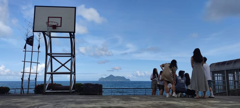 Daxi Daan Temple front basketball court, Yilan County - Jul 27, 2022 : Daxi Daan Temple front basketball court! Sitting on the dreamy sea view of Guishan Island, Yilan County, Taiwan