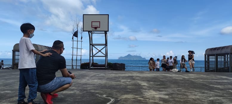 Daxi Daan Temple front basketball court, Yilan County - Jul 27, 2022 : Daxi Daan Temple front basketball court! Sitting on the dreamy sea view of Guishan Island, Yilan County, Taiwan