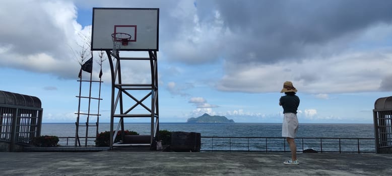 Daxi Daan Temple front basketball court, Yilan County - Jul 27, 2022 : Daxi Daan Temple front basketball court! Sitting on the dreamy sea view of Guishan Island, Yilan County, Taiwan