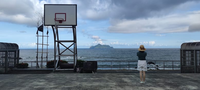 Daxi Daan Temple front basketball court, Yilan County - Jul 27, 2022 : Daxi Daan Temple front basketball court! Sitting on the dreamy sea view of Guishan Island, Yilan County, Taiwan