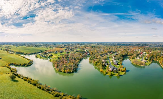 Aerial footage of residential subdivision by a lake in Central Kentucky in fall