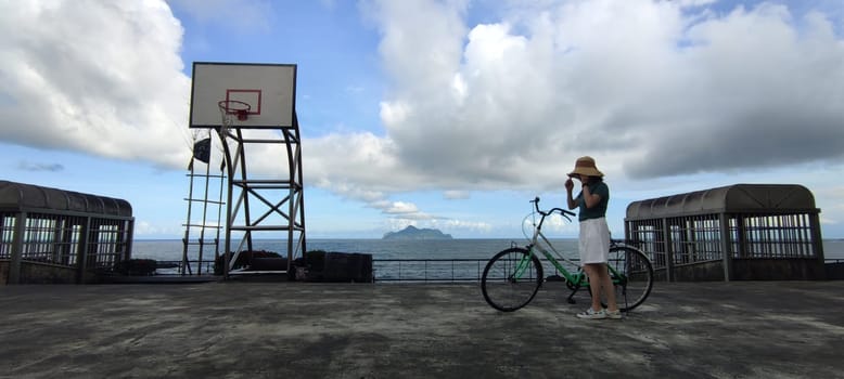 Daxi Daan Temple front basketball court, Yilan County - Jul 27, 2022 : Daxi Daan Temple front basketball court! Sitting on the dreamy sea view of Guishan Island, Yilan County, Taiwan