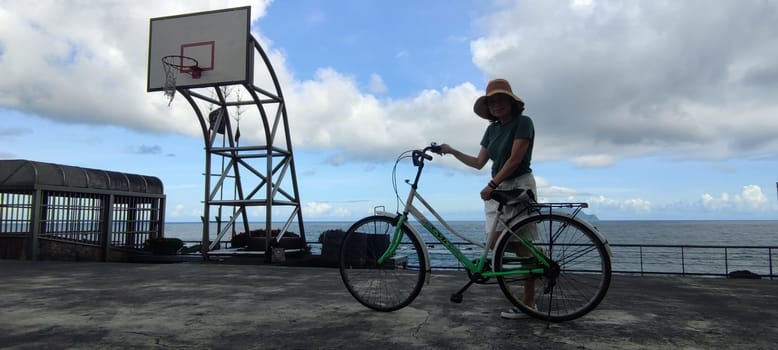 Daxi Daan Temple front basketball court, Yilan County - Jul 27, 2022 : Daxi Daan Temple front basketball court! Sitting on the dreamy sea view of Guishan Island, Yilan County, Taiwan
