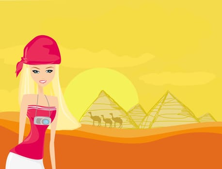 Women on background the pyramids in Giza built for the pharaoh.