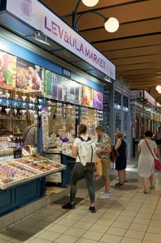 Tourists in the big market hall, Nagy Vásárcsarnok, a popular sight in Budapest