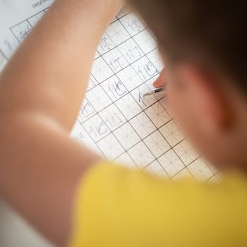 Boy learns chinese langruage and hieroglyphs editorial