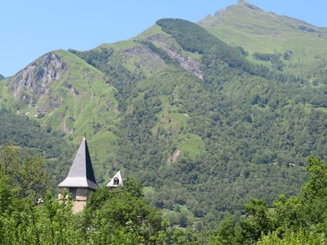 beautiful natural mountain landscape with a pointed roof church