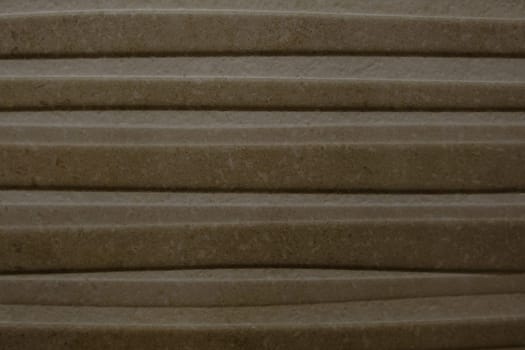 Beige and brown bath tiles lines texture.