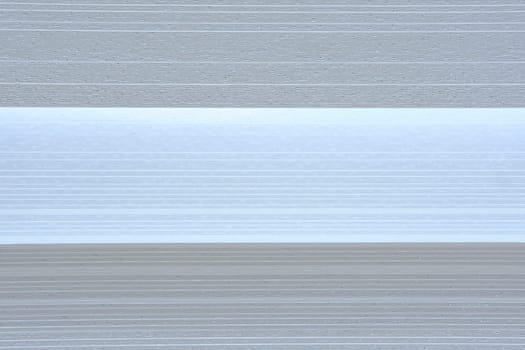 Strips of fabric with different shades of white color.