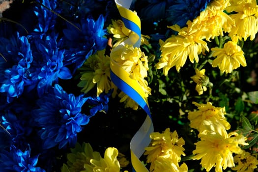 Blue and yellow stripes with colored flowers Ukraine flag, the war in Ukraine concept.
