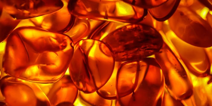 The warm color of amber. Close up of amber.