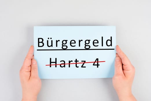 The german word for citizen money is standing on a paper, Hartz 4 is crossed out, new financial help system for unemployment in Germany, social issue