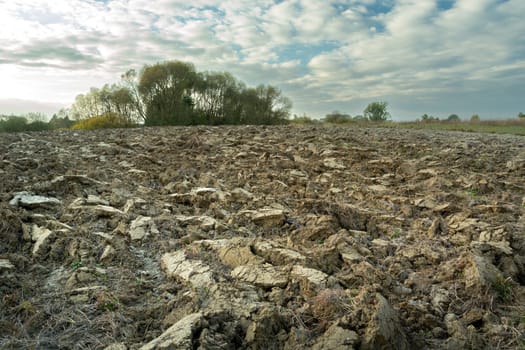 Plowed ground in the field and the evening sky, Zarzecze, Poland