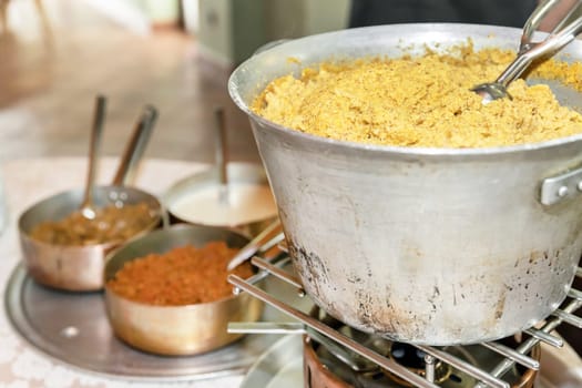 Polenta. Typical dish from Bergamo cooked in the traditional copper pot.