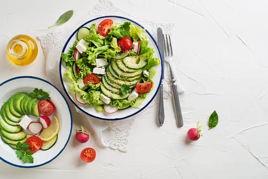 Green salad with avocado, tomato, feta cheese and fresh vegetables