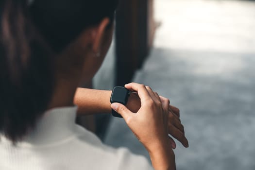 women checking on smart watch