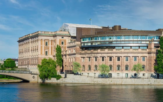 Riksdagshuset, the Swedish Parliament House, located on the island of Helgeandsholmen, Old town, or Gamla Stan, Stockholm, Sweden, in a summer day