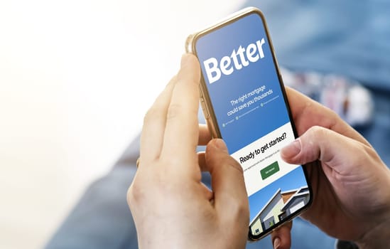 San Francisco, CA, US, May 2022: Female hands holding a phone with Better company web page on screen. Better is an American company which operates an online platform for mortgage