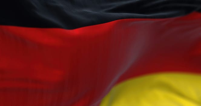 Close-up view of the German national flag waving in the wind. Germany is an European country.