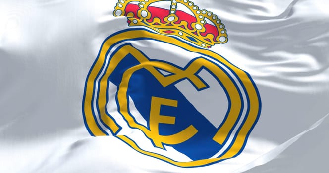 Madrid, Spain, May 2022: The flag of Real Madrid Club de Futbol waving in the wind on a clear day. Real Madrid C.F. is a Spanish professional football club based in Madrid