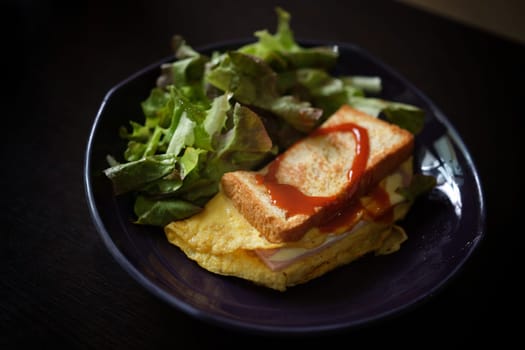 Sandwiches with egg, ham and toast cheese fried in dish
