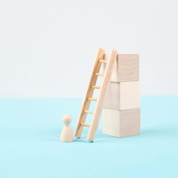 Man is standing next to a ladder, climbing up in career, having a goal, brainstorming for ideas, success strategy, taking a challenge, business concept